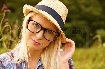 Buy stock photo Smile, glasses and portrait of woman in nature with a straw hat sitting in an outdoor garden for fresh air. Happy, fashion and female person from Australia in forest, woods or field with casual style