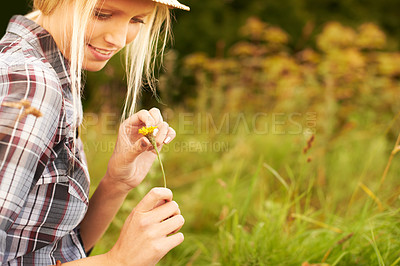 Buy stock photo Spring, meadow and woman pick flower in field for freedom, wellness and fresh air outdoors. Nature, sunshine and happy hipster female person in countryside for relax, sustainability and ecology