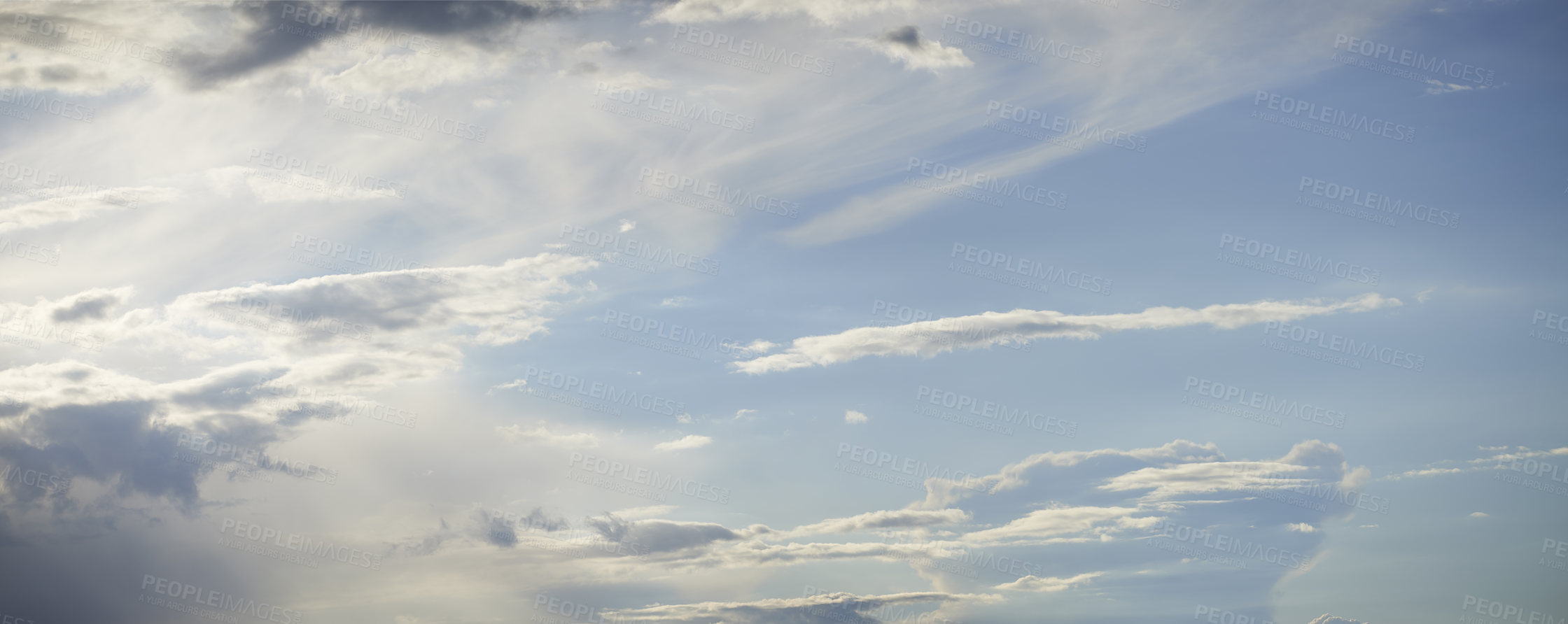 Buy stock photo View of clouds with copy space in a blue sky during summer. Clear weather and blue sky with fluffy white clouds. Low angle of a nature background, horizon, cumulus clouds and sunshine during the day