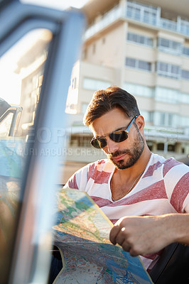 Buy stock photo Map, car and man on road trip for vacation, getaway or holiday with transportation for search. Outdoor, adventure and male person in vehicle for navigation on weekend journey, destination or travel.