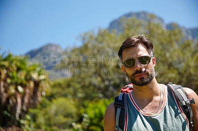 Buy stock photo A hiker with a backpack on his back