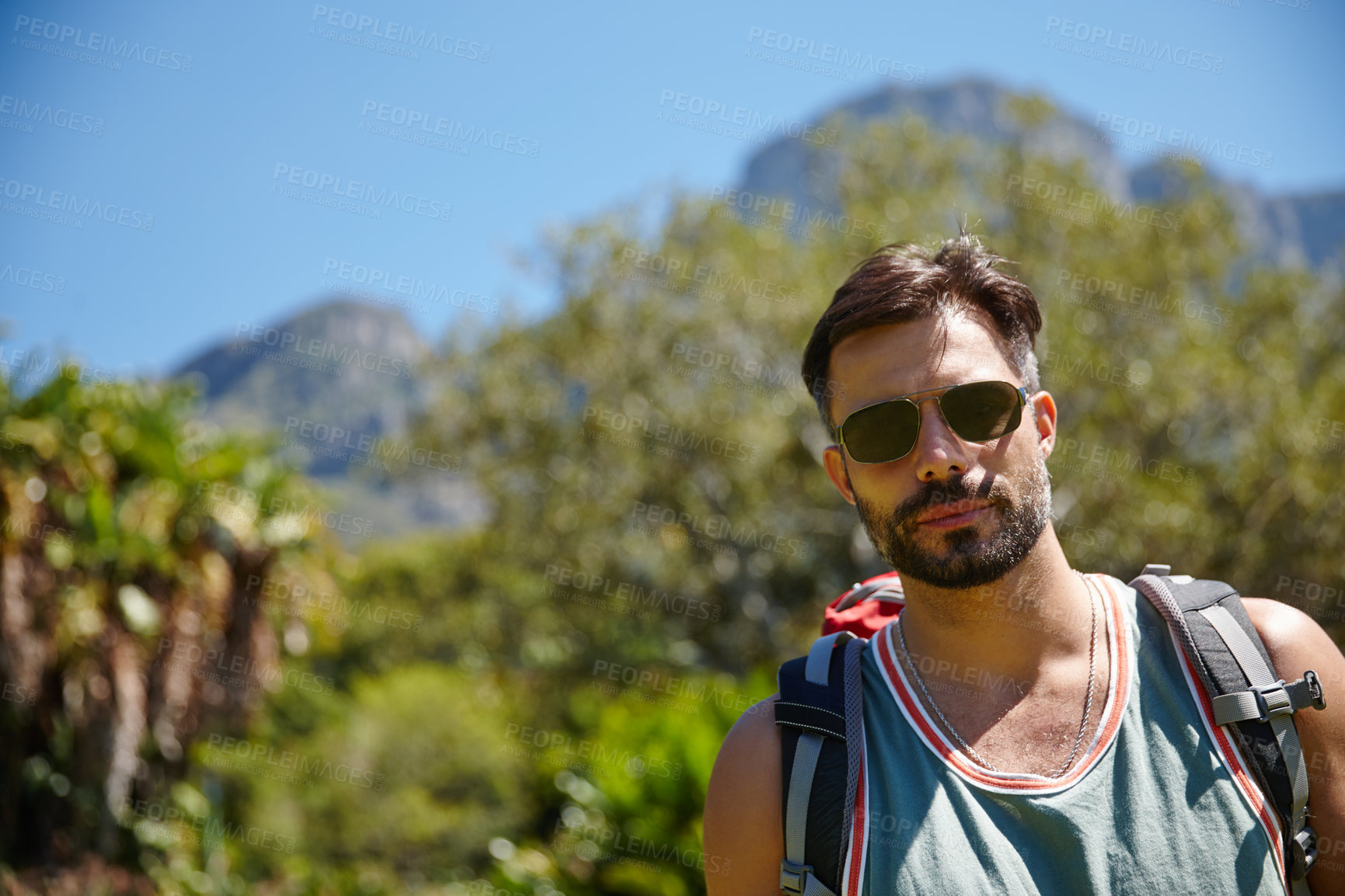 Buy stock photo A hiker with a backpack on his back