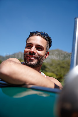 Buy stock photo Shot of a young man on a roadtrip