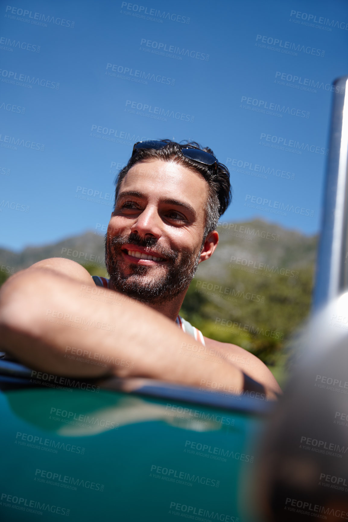 Buy stock photo Shot of a young man on a roadtrip