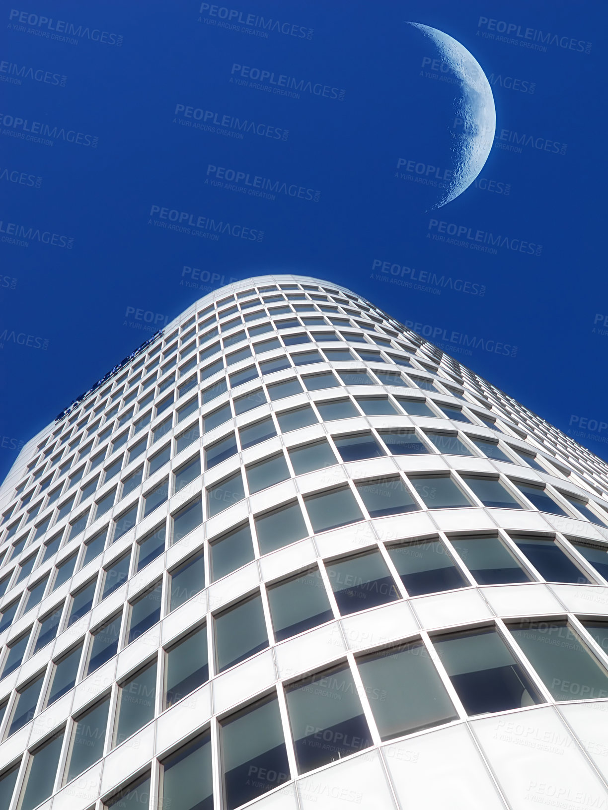 Buy stock photo Half a moon over a building skyscraper, shining in bright blue sky. Below the crescent of quarter moon over a tall modern structural architecture, foreboding doomed capitalism or an economical crisis