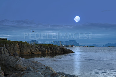 Buy stock photo Mountain, sea and moon in sky at evening for travel on coast with fog for forecast weather. Clouds, rocks and sphere lunar satellite by ocean water with mist at night for beautiful scenic view.