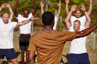 Buy stock photo Men, fitness or back with soldiers for military bootcamp, physical activity or training on grass field. Male people, trainer or superior officer with team or army in drill for endurance test or exam