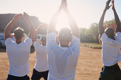 Buy stock photo Rearview shot of a group of men doing exercises at a military bootcamp
