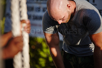 Buy stock photo Shot of a man at bootcamp looking exhausted