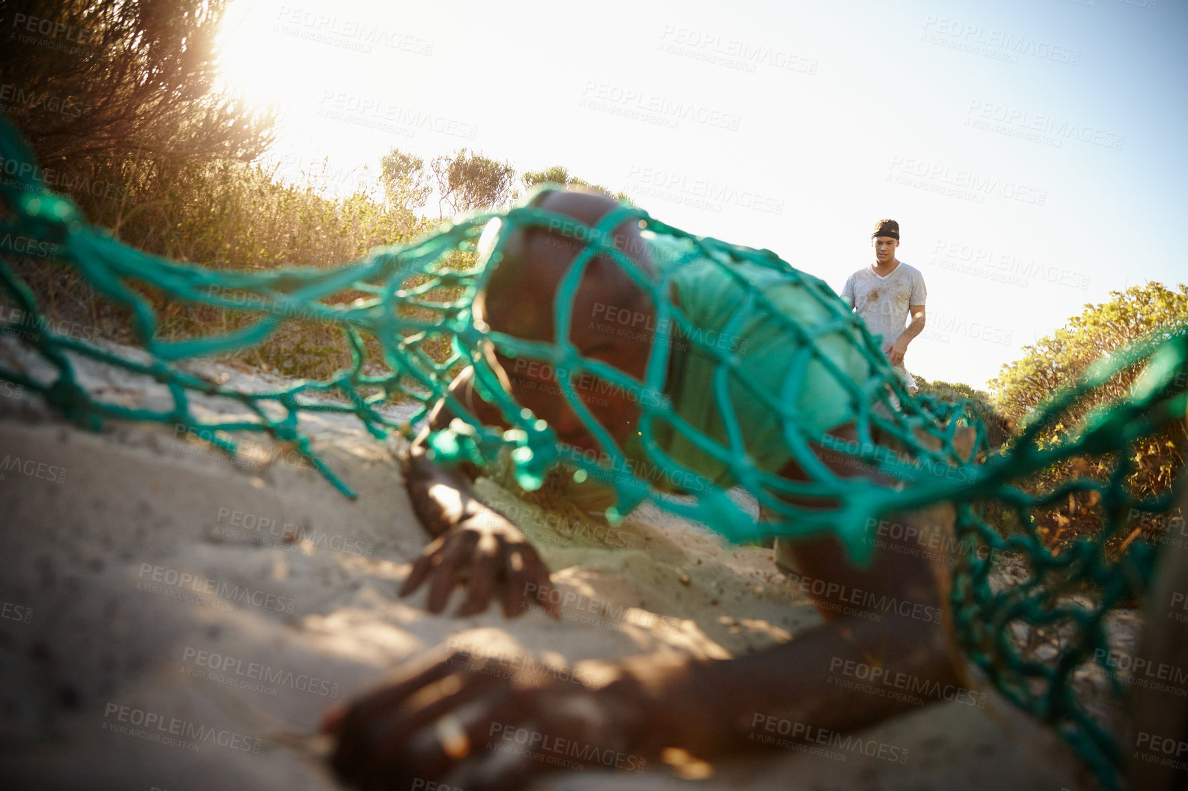 Buy stock photo Shot of a man going through an obstacle at bootcamp