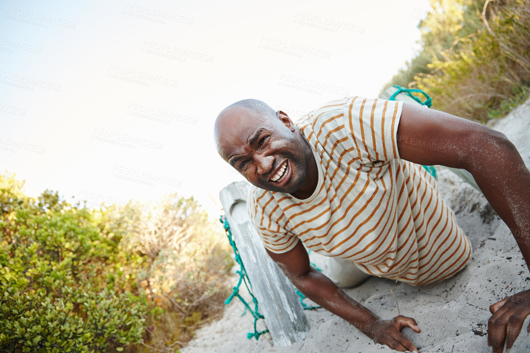 Buy stock photo Shot of a man going through a tough obstacle course at bootcamp