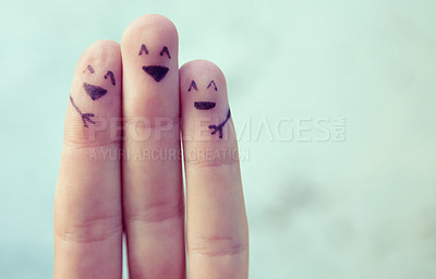 Buy stock photo Cropped shot of fingers with smileys drawn on them