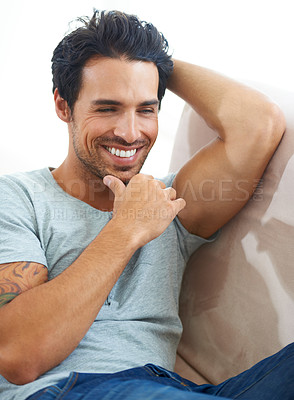 Buy stock photo Thinking, smile and man on a sofa with happy memory, moment or positive in his home. Remember, face and cheerful male person in living room with relief, peace and moment of joy of reflection