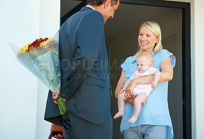 Buy stock photo Cropped shot of a man surprising his wife with flowers