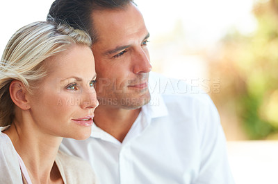 Buy stock photo Cropped shot of a happily married couple sitting outside