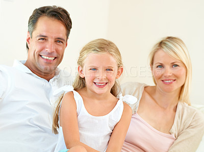 Buy stock photo Family, portrait and happy on sofa with relax, peace and love for bonding and relationship in living room. Parents, girl kid or face and smile on couch of lounge for care, break and enjoyment in home