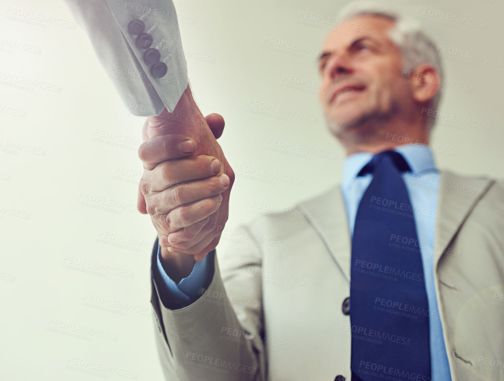 Buy stock photo Handshake, senior businessman and agreement in partnership, teamwork and thank you for recruitment. Male person, low angle and deal for merger in workplace, collaboration and support in cooperation