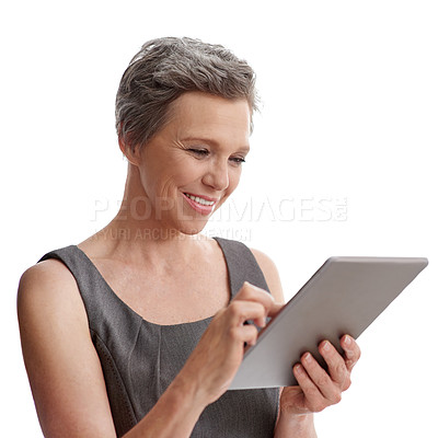 Buy stock photo A mature businesswoman working on her digital tablet