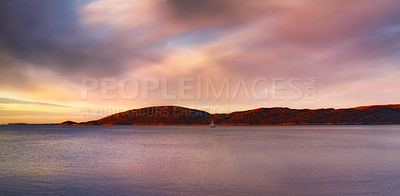 Buy stock photo Sky, clouds and mountain with ocean in nature for travel destination, peace and calm water. Tropical island, coast and wallpaper of sea at sunset for holiday, vacation and outdoor environment in Bali