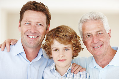 Buy stock photo Boy, portrait and hug with dad or grandpa in home, support and happy for together generations in lounge. Male person, care and smile in childhood, embrace and love in bonding or security in house