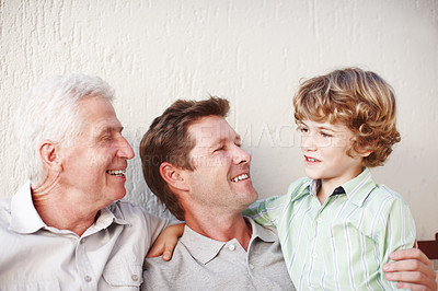 Buy stock photo Happy grandpa, father and child in home for bonding, family relationship and generations on wall background. Smile, hug and senior grandfather, dad and young boy embrace for love, chat and relax