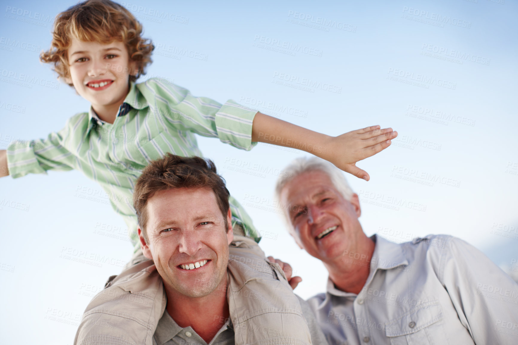 Buy stock photo Portrait of grandpa, father and child by blue sky for bonding, relationship and relax together. Family, fun and grandfather, dad and young boy on shoulders for holiday, vacation and weekend outdoors