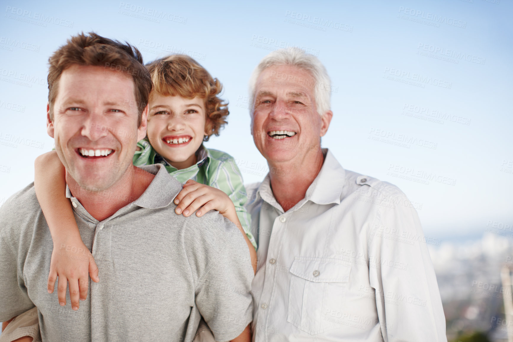 Buy stock photo Cropped portrait of a young boy with his father and grandfather