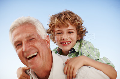 Buy stock photo Portrait, grandfather and boy with a smile, piggy back and bonding outdoor, sky and happiness. Face, happy grandad and male grandchild with joy, loving and care with relationship, cheerful and family