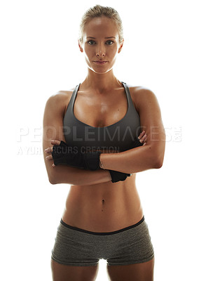 Buy stock photo Portrait of a beautiful young woman in workout clothing standing with her arms crossed