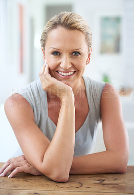 Buy stock photo Cropped portrait of an attractive businesswoman sitting in the office