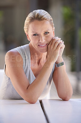 Buy stock photo Cropped portrait of an attractive businesswoman sitting in the office