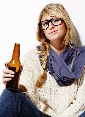 Buy stock photo Woman, portrait and relax with beer or drink of nerd, geek or hipster on a studio white background. Attractive young female person or model with glasses, cool or fashion style holding alcohol bottle