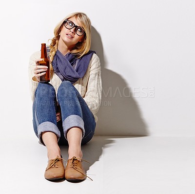 Buy stock photo Portrait, glass beer bottle and thinking with a woman in studio on a mockup white background. Party, event or space with a young drunk girl drinking an alcohol beverage for celebration or to relax
