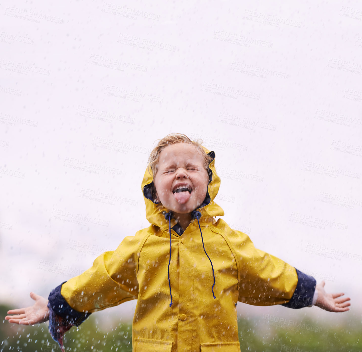 Buy stock photo Girl outdoor, rain and play in space for mockup with tongue, happiness or winter fashion. Female kid, raincoat or playing with water, open hands and excited face on adventure with freedom in mock up