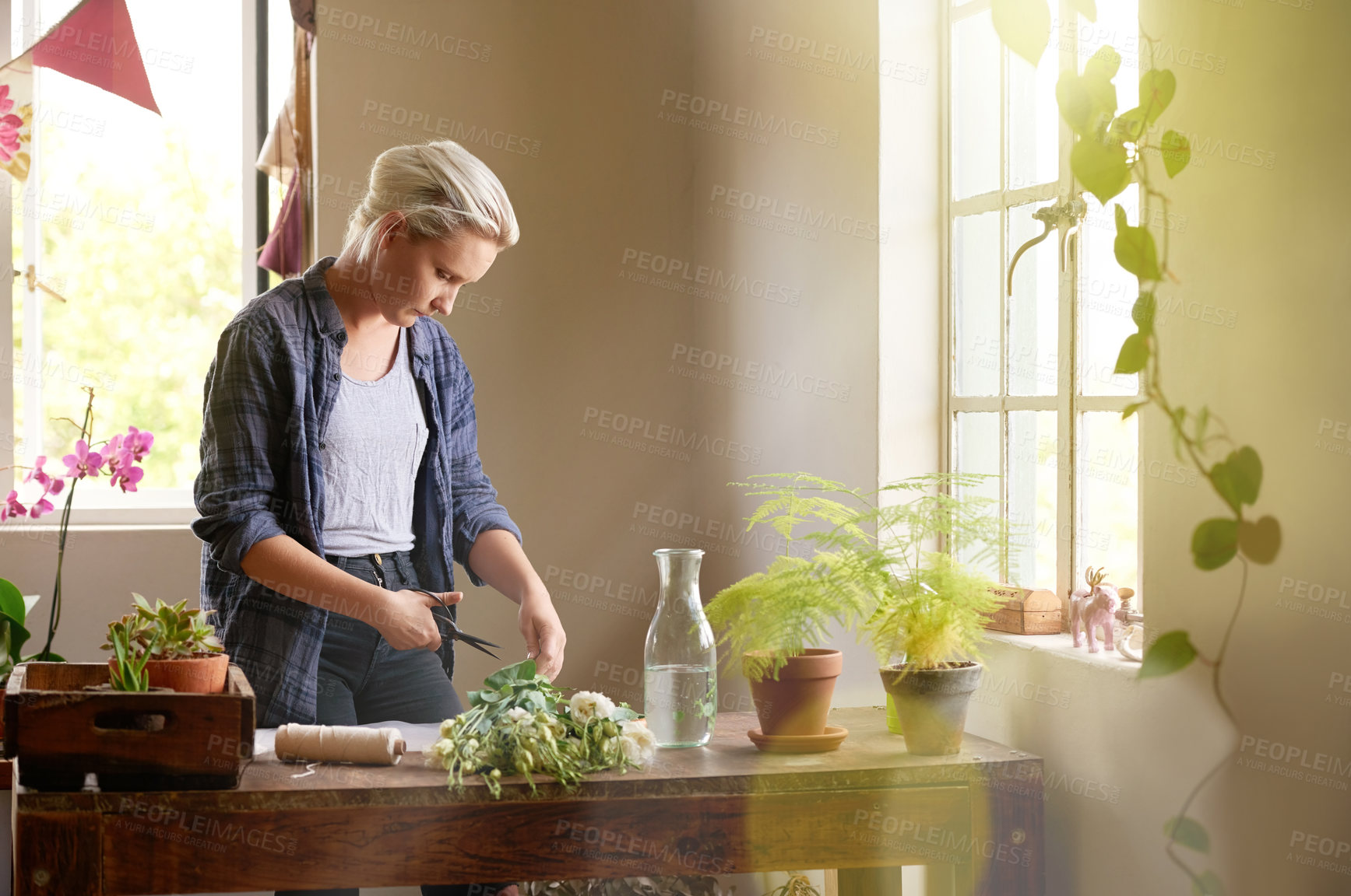 Buy stock photo Cutting, flowers and retail with woman in nursery for sale of bouquet in small business startup. Bunch, plants and scissors with employee or entrepreneur person in floral shop for cultivation