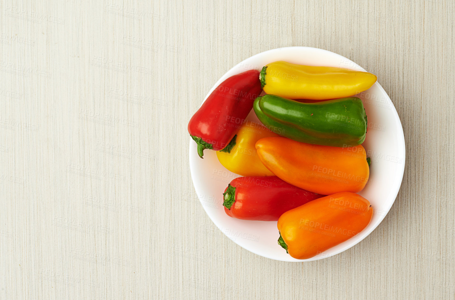 Buy stock photo Healthy, food and bell pepper in kitchen for natural nutrition and background of product for high source of vitamin c. Above, diet and fresh vegetables for salad, lunch or dinner in bowl or house