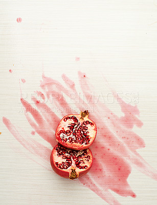 Buy stock photo Pomegranate, fruit and juice on table top for nutrition, wellness and diet isolated for health. Vegan, organic and eco friendly in studio for mockup, breakfast and snack on white background above