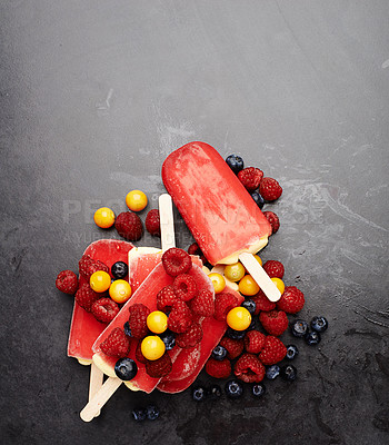 Buy stock photo Popsicles, blueberries and fruit for tasty summer treat, snack or frozen dessert in studio background. Fresh, ice lolly and collection of food on counter top for nutrition, diet and yummy eating