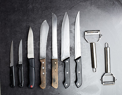 Buy stock photo Knives, tools and kitchen equipment on table for professional chef, restaurant and culinary steel. Instrument, cutlery and blade for gourmet cafe, cutting and catering service in studio for meal prep