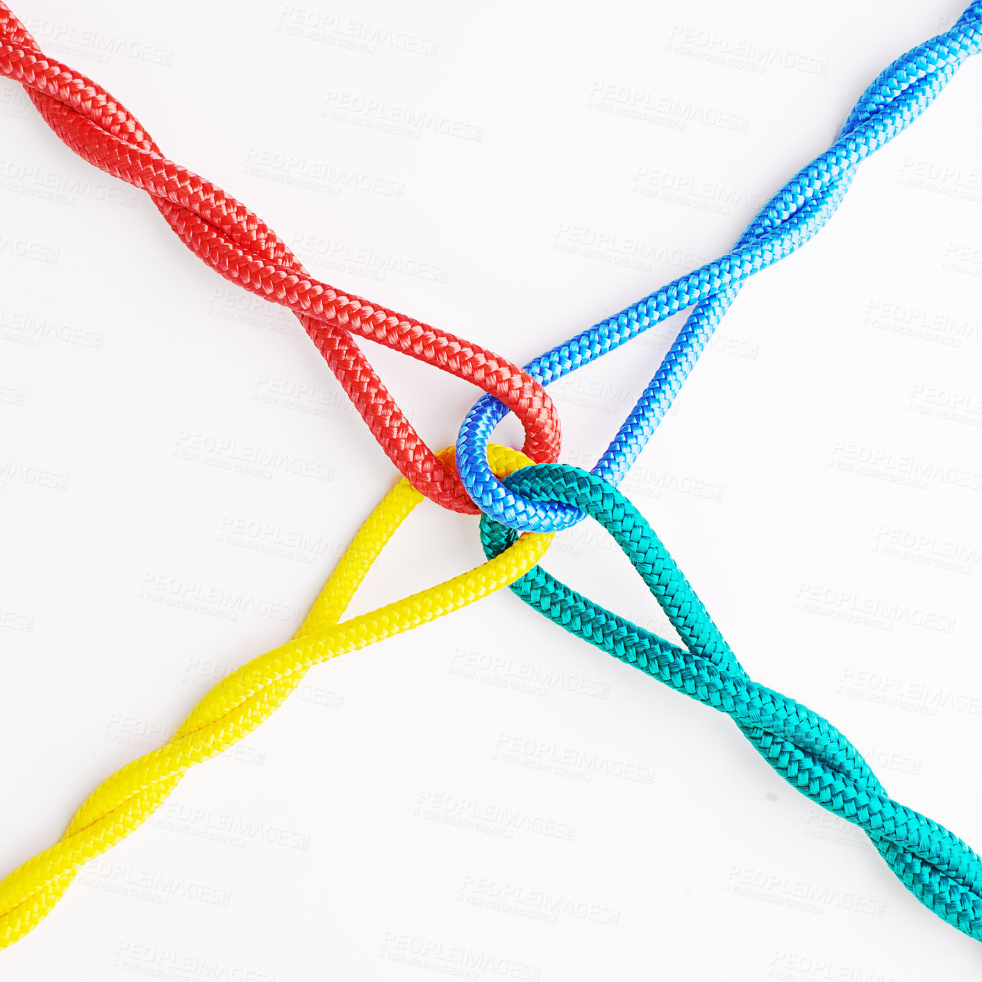 Buy stock photo Rope, knot and color tied in studio for security with equipment for support with white background. Olympics, unity and collaboration with safety for strength in cooperation for together with string