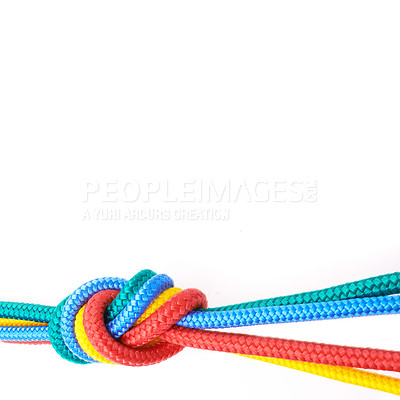 Buy stock photo Rainbow colour ropes knotted together, representing LGBTQ, freedom, tolerance and acceptance on a white background. Connected group of ropes tied and linked together in unity and togetherness