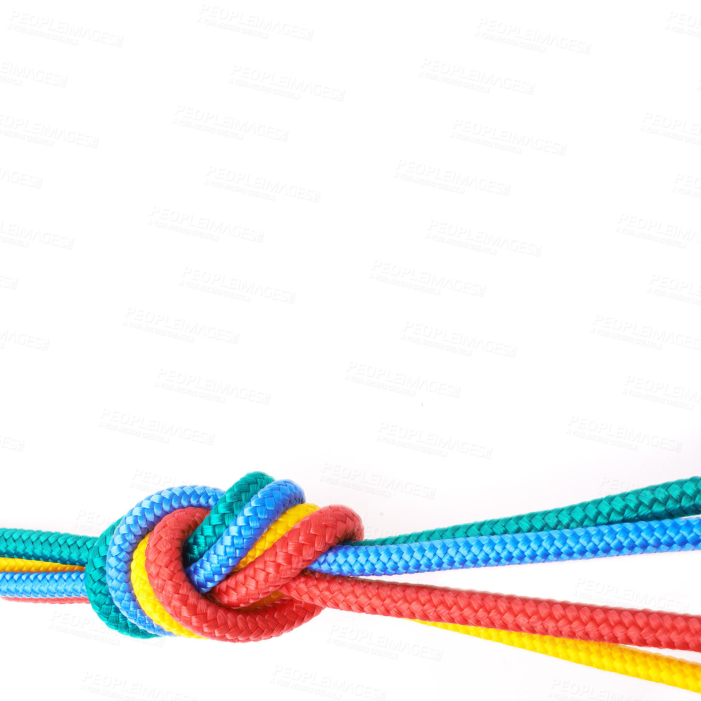 Buy stock photo Rainbow colour ropes knotted together, representing LGBTQ, freedom, tolerance and acceptance on a white background. Connected group of ropes tied and linked together in unity and togetherness