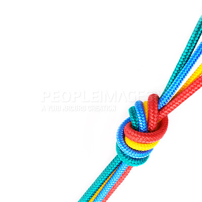 Buy stock photo Rope, ties and connection of color in knot or braid on white background in studio for solidarity. Security, cord and abstract unity of rainbow society with ties together in collaboration of community