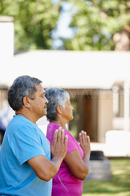 Buy stock photo Portrait of a mature couple doing yoga together in their backyard