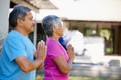 Buy stock photo Portrait of a mature couple exercising together in their backyard