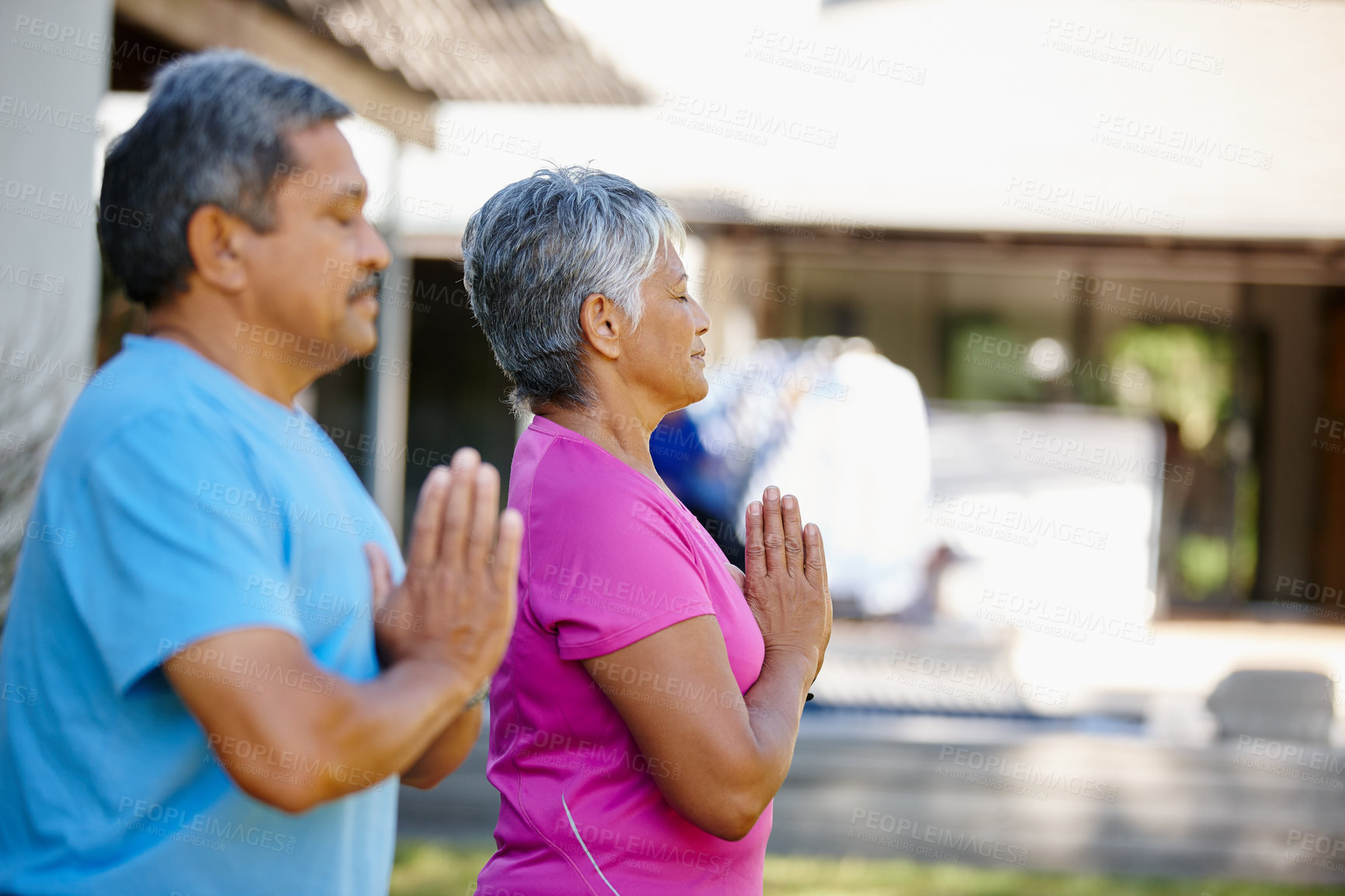 Buy stock photo Portrait of a mature couple exercising together in their backyard