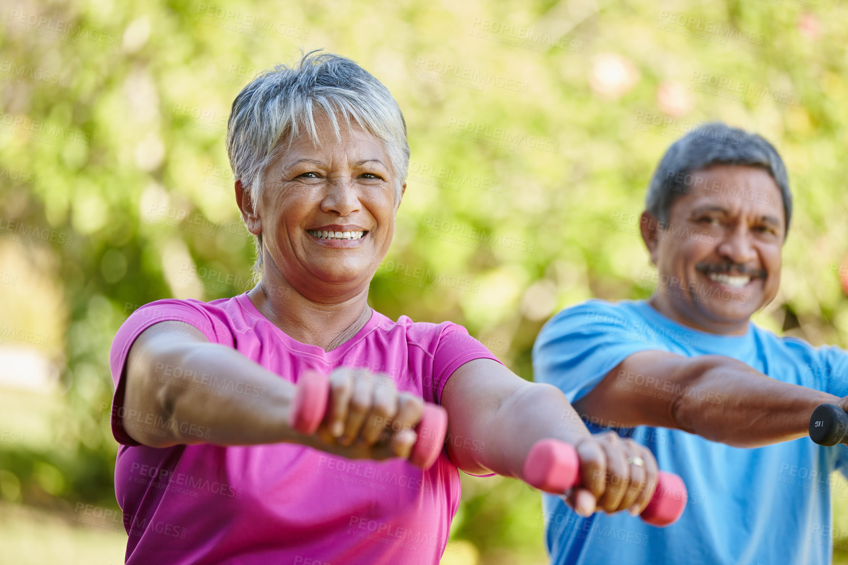 Buy stock photo Portrait of a mature couple exercising together in their backyard