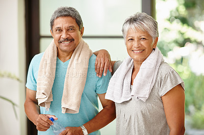 Buy stock photo Portrait of a mature couple taking a break from exercising