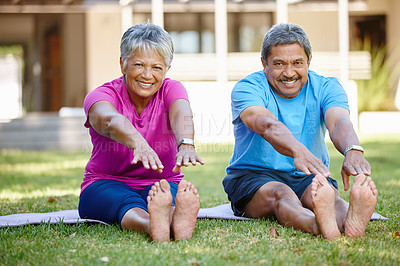 Buy stock photo Portrait of a mature couple doing yoga together in their backyard