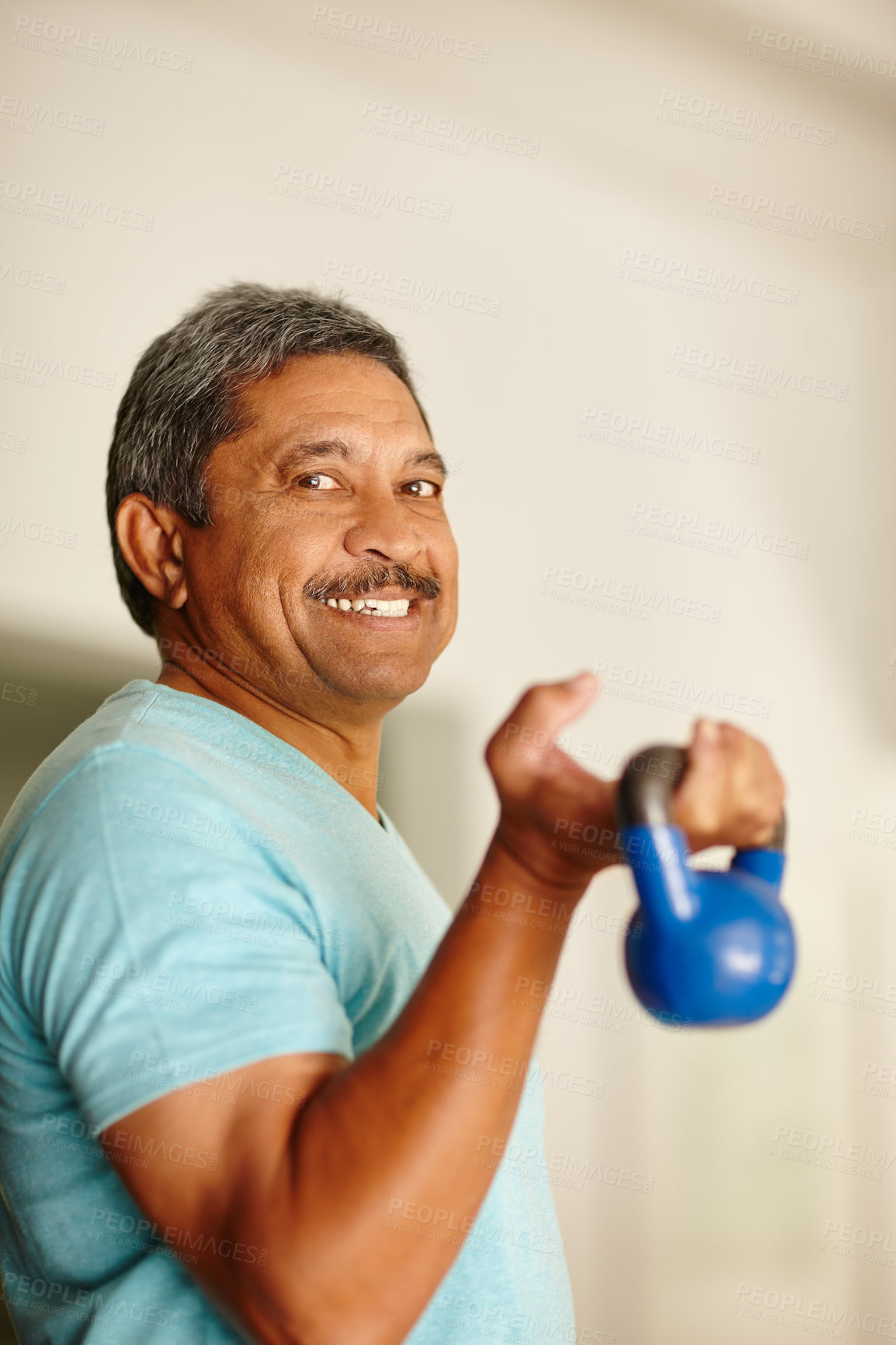 Buy stock photo Cropped shot of a mature man lifting dumbbells